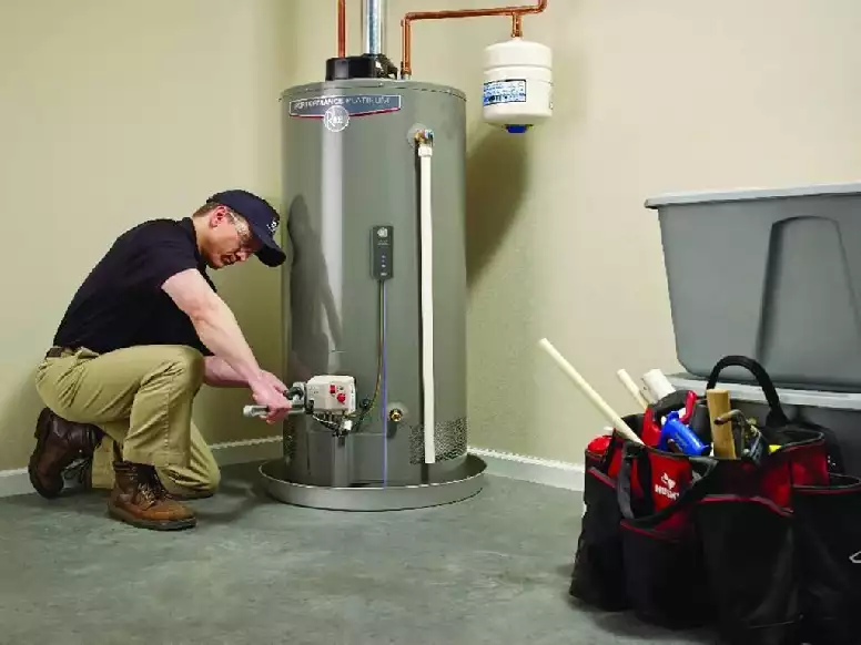picture of a plumbing contractor making an installation of a water heater